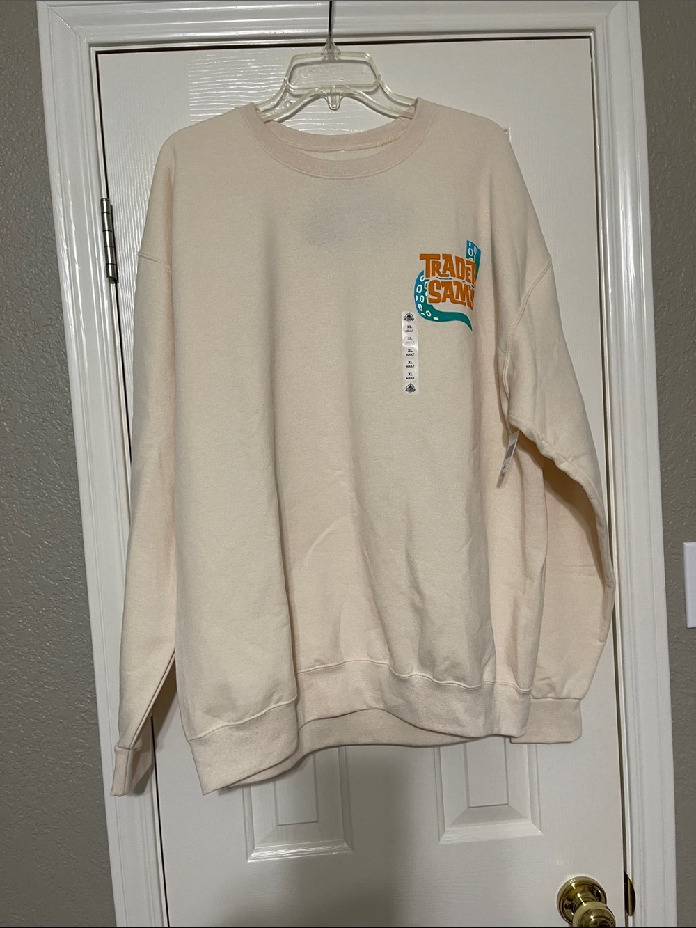 Disney Cream Crewneck Sweatshirt with Colorful 'Trader Sams' Graphic